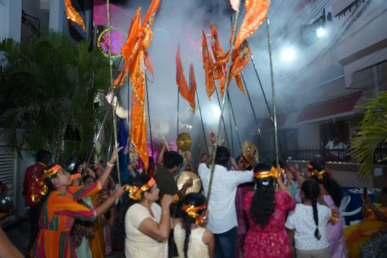 Devotees dancing with saffron flags